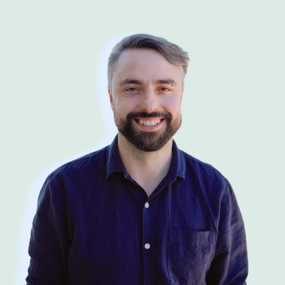photo of Steve smiling and wearing a navy blue shirt